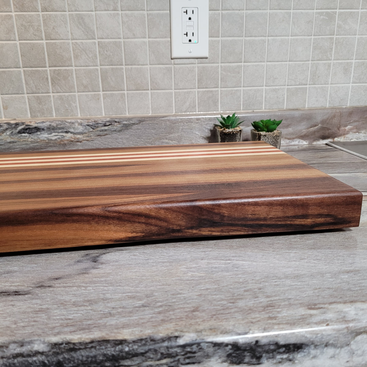 African Padauk and Maple wood end grain cutting board. 15” x 12” x 1.25”