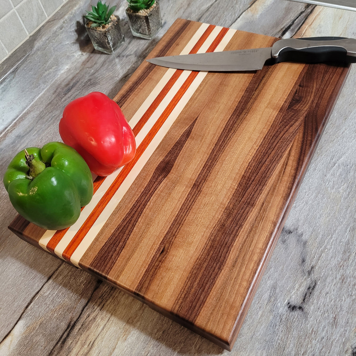 African Padauk and Maple wood end grain cutting board. 15” x 12” x 1.25”